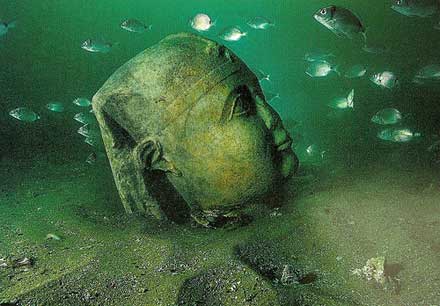 A serene face of a statue underwater in Alexandria